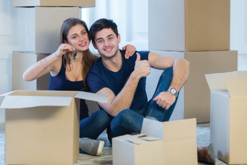 Packed office furniture and equipment ready for moving in Acton