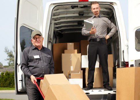 Local movers loading a van for a house move in Acton