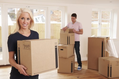 Furniture and boxes loaded into a van for Acton transport