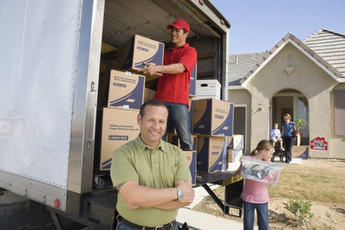 Professional removal team planning access for an Acton apartment move