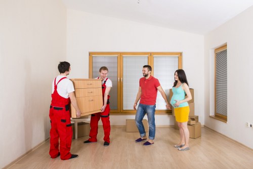 Prepared boxes and furniture ready for man with van service in Acton