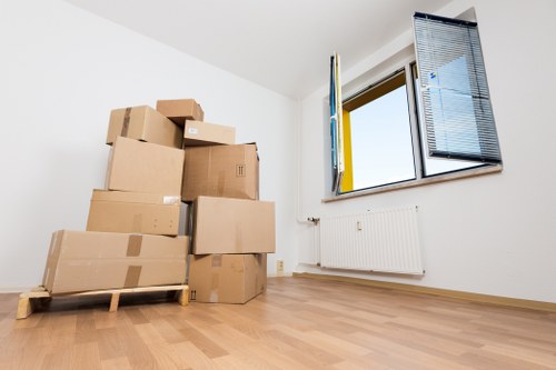 Local moving team preparing boxes in Acton