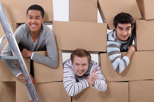 Office furniture being relocated by movers in Acton