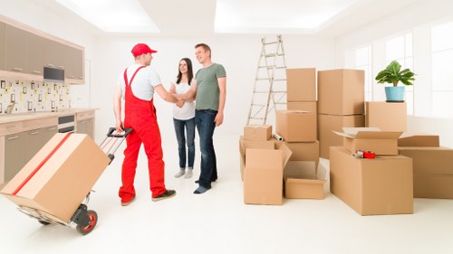 Local removals team loading items for a move in Acton