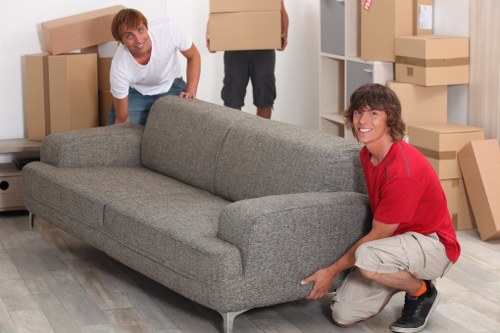 Local moving team unloading boxes into a new home near Acton