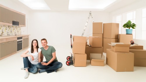 Moving boxes and household items in a local Acton street