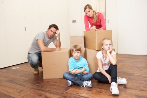 Removal team preparing a home move in Acton with boxes and furniture