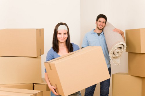 Worker lifting a box using correct manual handling technique