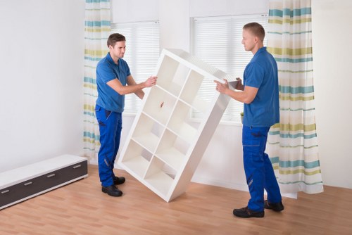 Loading furniture into a removal van on an Acton street