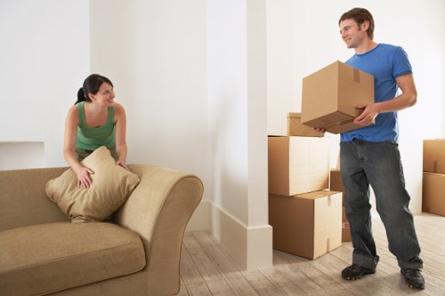 Packed moving boxes ready for a residential move in Acton
