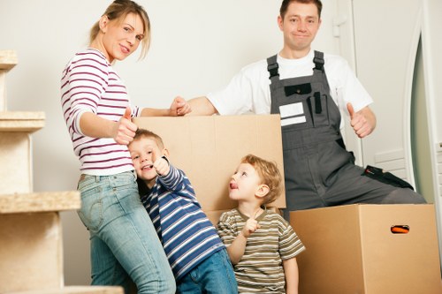 Removal van and movers handling a residential move in Acton